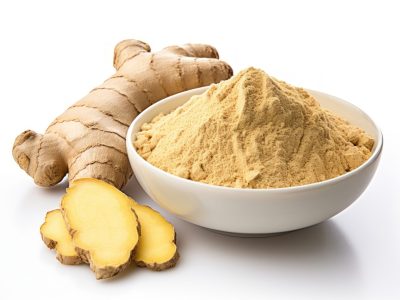 Ginger root and ginger powder in a bowl spice plant food.